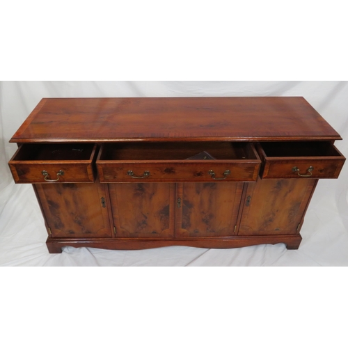 15 - Edwardian style inlaid yew sideboard with three frieze drawers, shelved presses under, on bracket fe... 