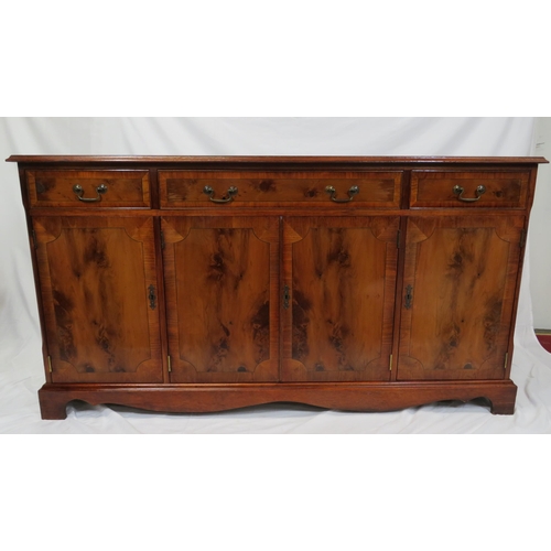 15 - Edwardian style inlaid yew sideboard with three frieze drawers, shelved presses under, on bracket fe... 