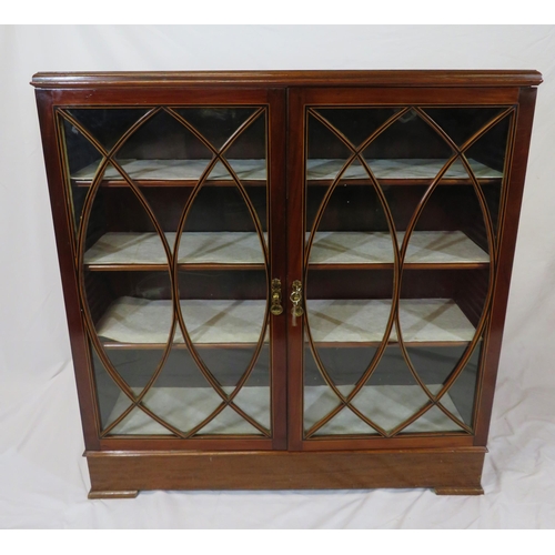 150 - Edwardian inlaid mahogany bookcase or cabinet with glazed doors, ornate fretwork, shelved interior, ... 