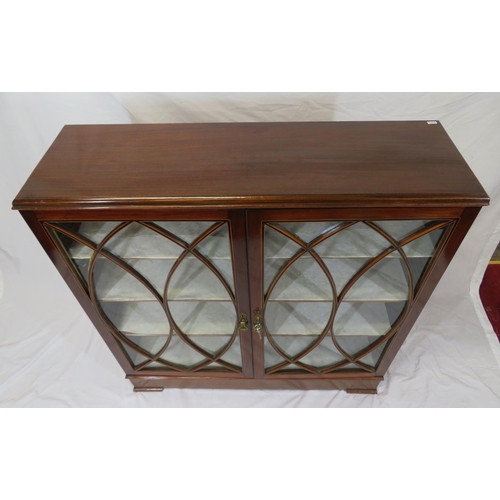 150 - Edwardian inlaid mahogany bookcase or cabinet with glazed doors, ornate fretwork, shelved interior, ... 