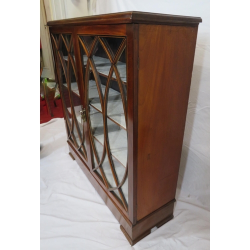 150 - Edwardian inlaid mahogany bookcase or cabinet with glazed doors, ornate fretwork, shelved interior, ... 