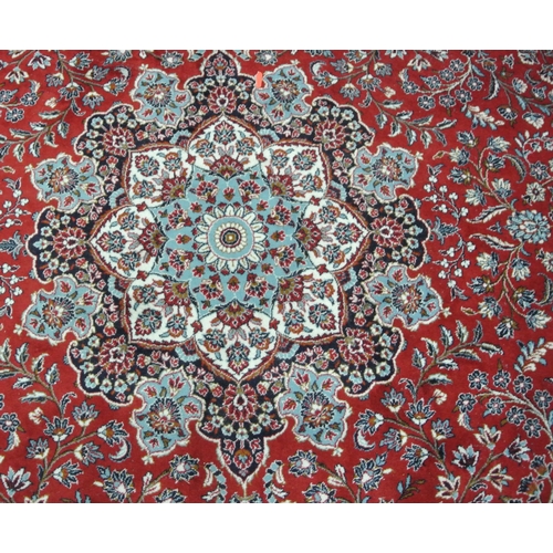 176 - Large red ground full pile Iranian carpet with Kashan design 4x3m