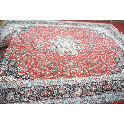 176 - Large red ground full pile Iranian carpet with Kashan design 4x3m