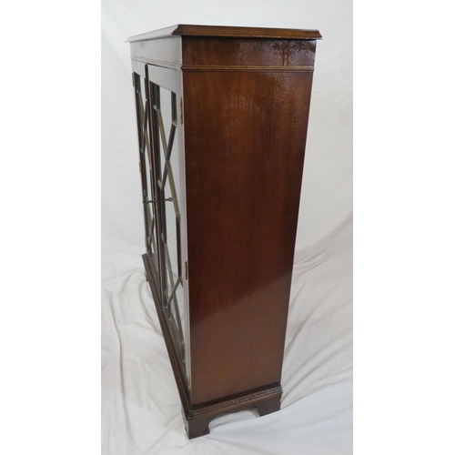 20 - Edwardian mahogany bookcase with glazed doors, reeded shelving, on bracket feet