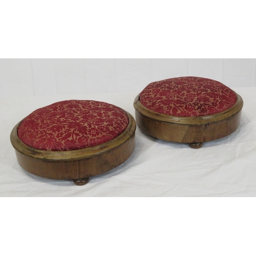 22 - Pair of round Georgian walnut footstools with foliate upholstery