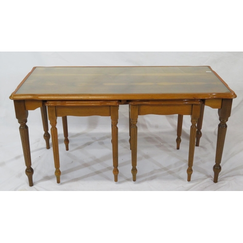 24 - Nest of 3 yew coffee tables with glass inset, on reeded tapering legs