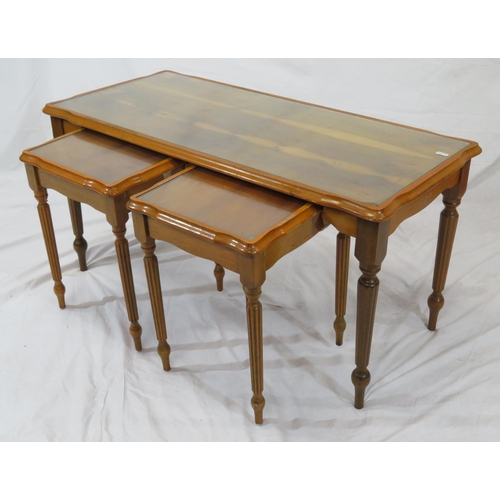 24 - Nest of 3 yew coffee tables with glass inset, on reeded tapering legs