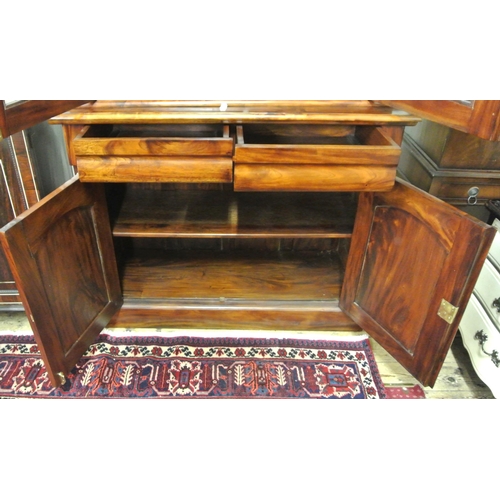 25 - Victorian style bookcase with shaped leaves, glazed doors with shelved interior, shelved press under... 