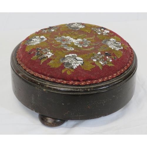 28 - Two round Georgian footstools with foliate needlepoint and turned legs