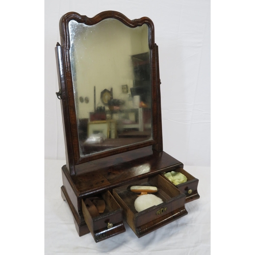 33 - William IV walnut swivel mirror with shaped top, tapering columns, three drawers under, on bracket f... 