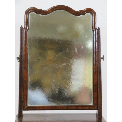 33 - William IV walnut swivel mirror with shaped top, tapering columns, three drawers under, on bracket f... 