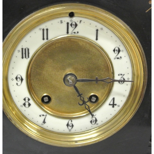 37 - French style slate mantle clock with circular brass framed dial, and foliate decoration