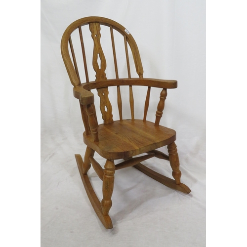 377 - Victorian style child's Windsor rocking chair with turned rails and shaped arms