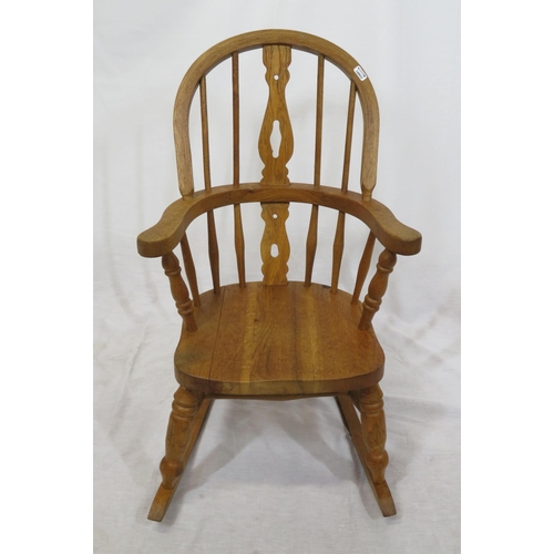 377 - Victorian style child's Windsor rocking chair with turned rails and shaped arms