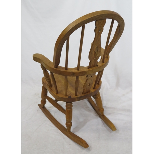 377 - Victorian style child's Windsor rocking chair with turned rails and shaped arms