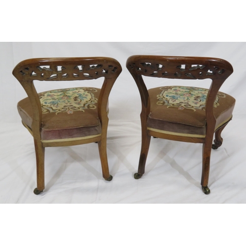 378 - Pair of Victorian low occasional chairs with scroll foliate carved rails, upholstered seat, on cabri... 