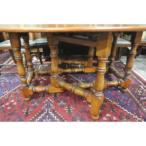 45 - Victorian style pine hunt or wake table with D-shaped drop leaves, pull-out gateleg supports, turned... 