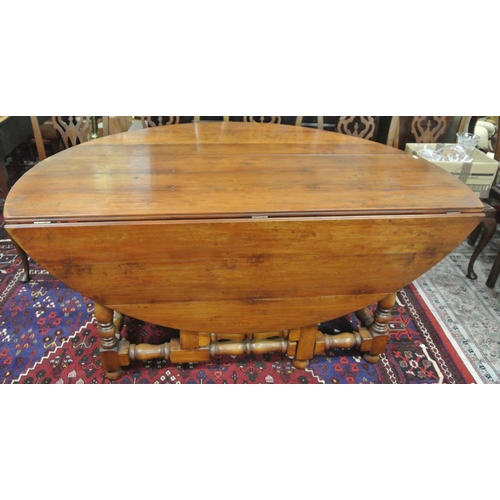 45 - Victorian style pine hunt or wake table with D-shaped drop leaves, pull-out gateleg supports, turned... 