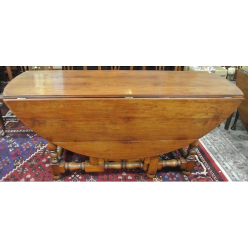 45 - Victorian style pine hunt or wake table with D-shaped drop leaves, pull-out gateleg supports, turned... 