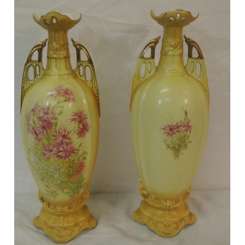 57 - Pair of Victorian style porcelain jars, with pierced handles, shaped tops, and ornate foliate and gi... 