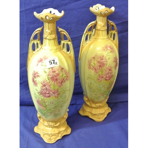 57 - Pair of Victorian style porcelain jars, with pierced handles, shaped tops, and ornate foliate and gi... 