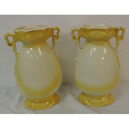 58 - Pair of Victorian style flower vases with shaped handles and foliate decoration