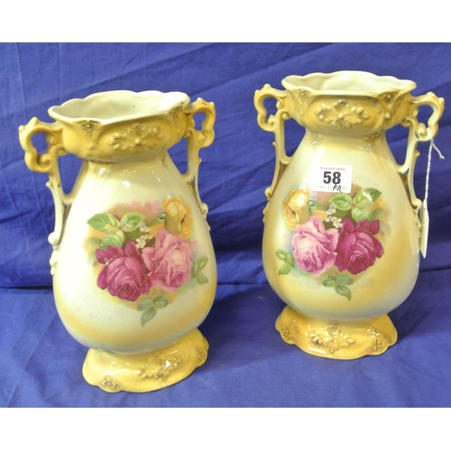 58 - Pair of Victorian style flower vases with shaped handles and foliate decoration