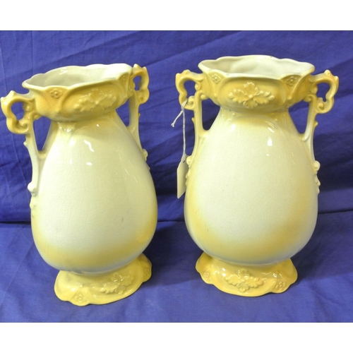 58 - Pair of Victorian style flower vases with shaped handles and foliate decoration