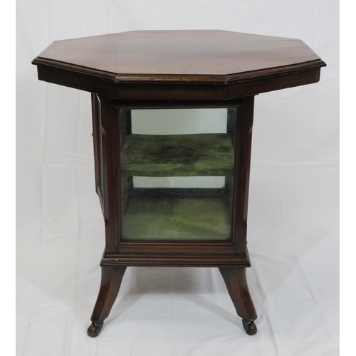 59 - Edwardian mahogany hexagonal table with glazed press under, on shaped legs with castors