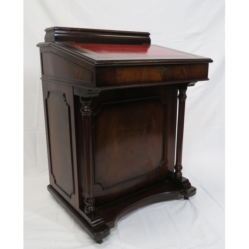 65 - Edwardian mahogany davenport with lift-up lid, side drawers with brass drop handles, on plinth