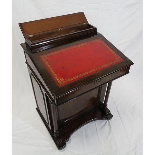 65 - Edwardian mahogany davenport with lift-up lid, side drawers with brass drop handles, on plinth