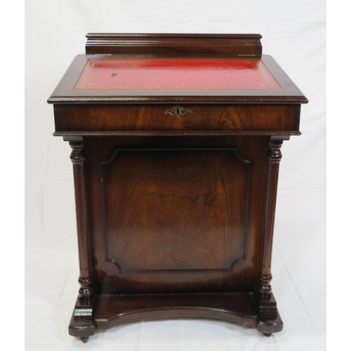 65 - Edwardian mahogany davenport with lift-up lid, side drawers with brass drop handles, on plinth