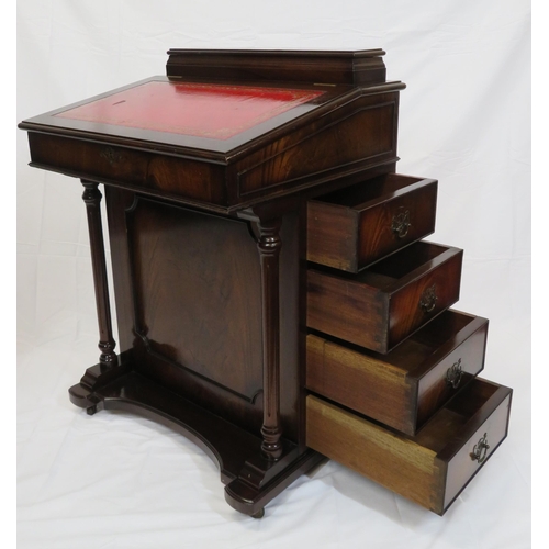 65 - Edwardian mahogany davenport with lift-up lid, side drawers with brass drop handles, on plinth