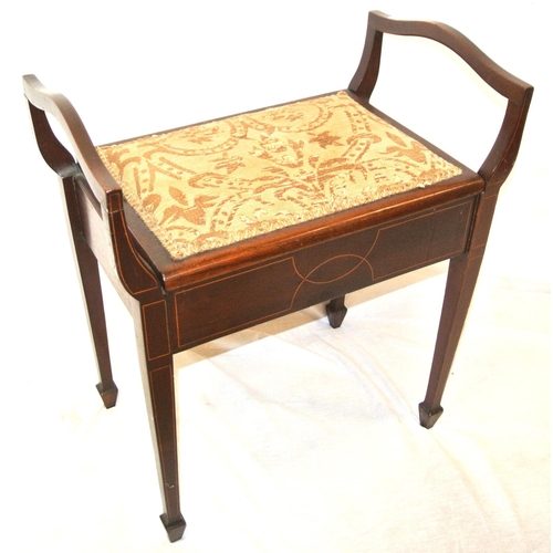 69 - Edwardian mahogany piano stool with upholstered lift-up lid, shaped arms, on inlaid tapering legs