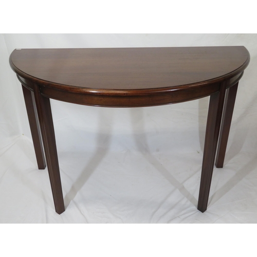 75 - Pair of Edwardian mahogany demi-lune side or alcove tables with rounded borders, raised on reeded ta... 