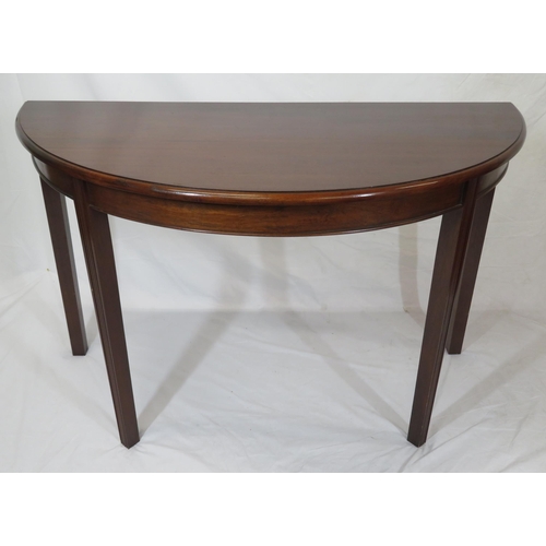 75 - Pair of Edwardian mahogany demi-lune side or alcove tables with rounded borders, raised on reeded ta... 