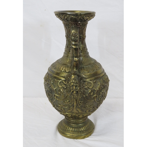 76 - Ornate baluster shaped gilded vase with ornate foliate figured and scroll decoration, on round stepp... 