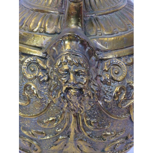 76 - Ornate baluster shaped gilded vase with ornate foliate figured and scroll decoration, on round stepp... 