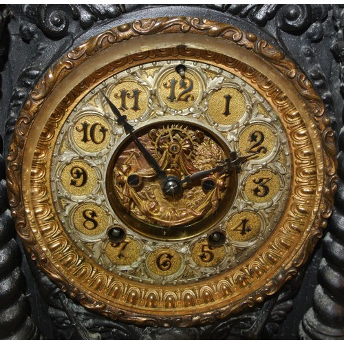 47 - Ornate cast metal mantle clock ornately decorated with vase finials, scrolls and foliage, ornate bra... 