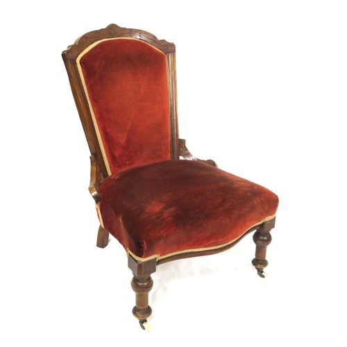 379 - Edwardian ladies chair with shaped back, on turned legs with casters