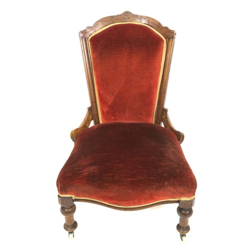 379 - Edwardian ladies chair with shaped back, on turned legs with casters