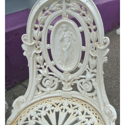 115 - Five piece cast iron garden or patio suite, round table & four chairs with figured and foliate decor... 