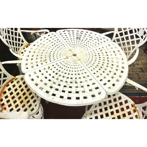 230 - Five piece cast iron garden suite, round table with pierced decoration and four armchairs with honey... 