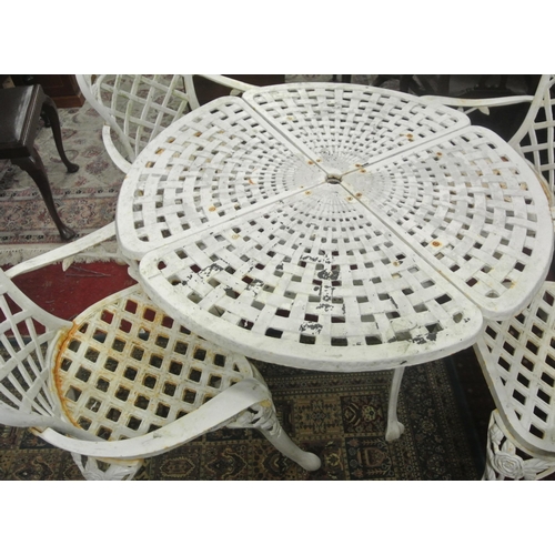 230 - Five piece cast iron garden suite, round table with pierced decoration and four armchairs with honey... 