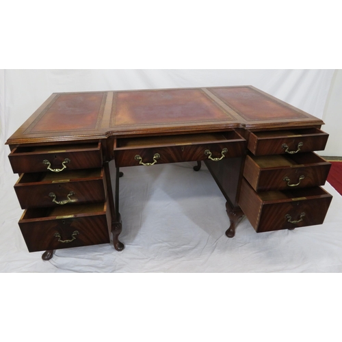 100 - Edwardian mahogany pedestal desk with seven drawers, leatherette inset, brass drop handles, on cabri... 