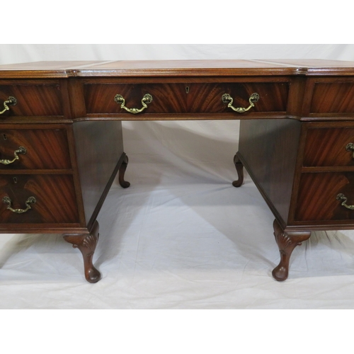 100 - Edwardian mahogany pedestal desk with seven drawers, leatherette inset, brass drop handles, on cabri... 