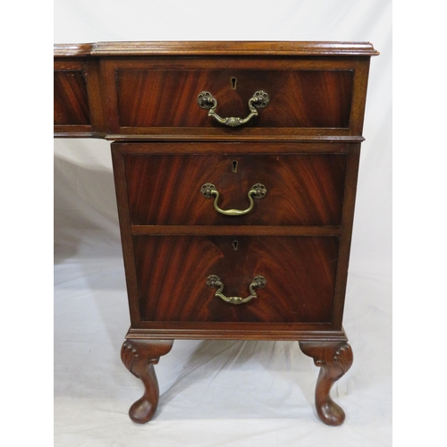 100 - Edwardian mahogany pedestal desk with seven drawers, leatherette inset, brass drop handles, on cabri... 