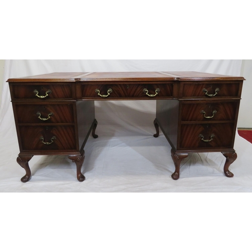 100 - Edwardian mahogany pedestal desk with seven drawers, leatherette inset, brass drop handles, on cabri... 