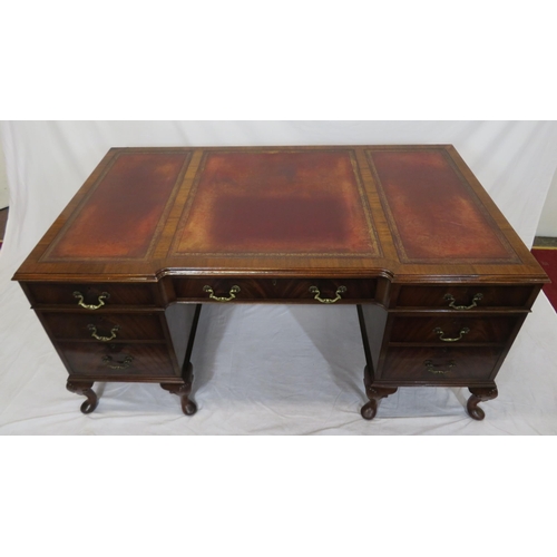 100 - Edwardian mahogany pedestal desk with seven drawers, leatherette inset, brass drop handles, on cabri... 