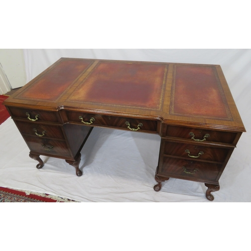 100 - Edwardian mahogany pedestal desk with seven drawers, leatherette inset, brass drop handles, on cabri... 